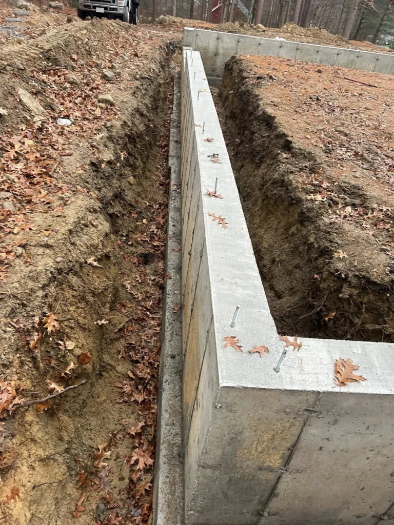 Excavated perimeter beside a concrete foundation wall