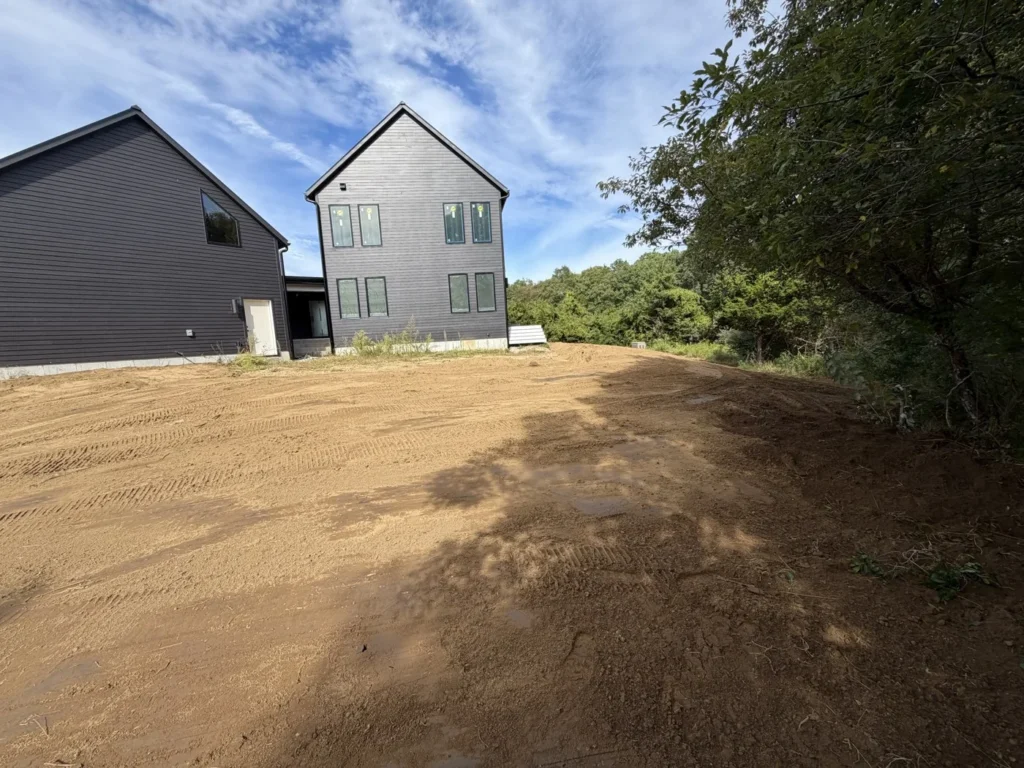Graded ground beside a residential home