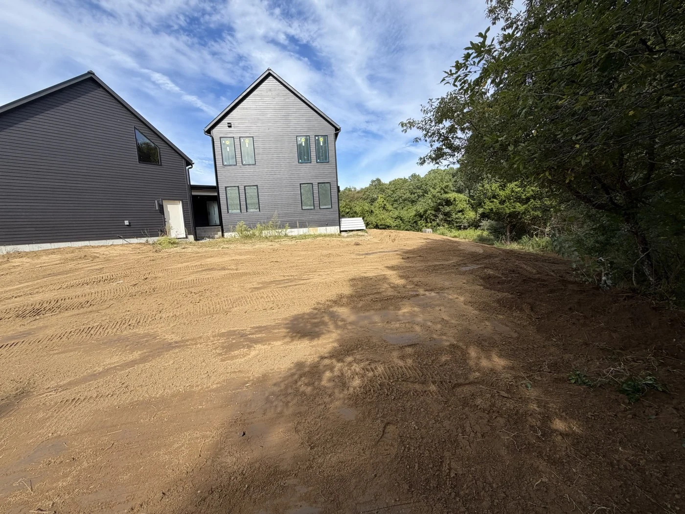 Graded ground beside a residential home