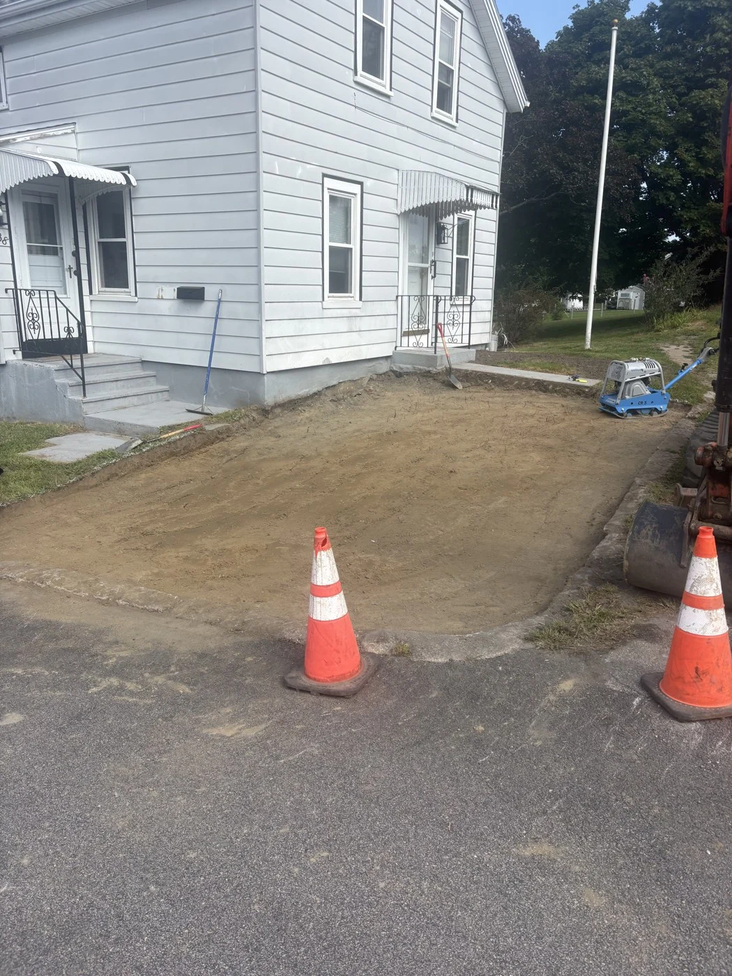 Prepared ground before placement of a gravel parking surface