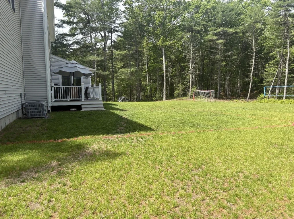 Residential yard before excavation and base preparation