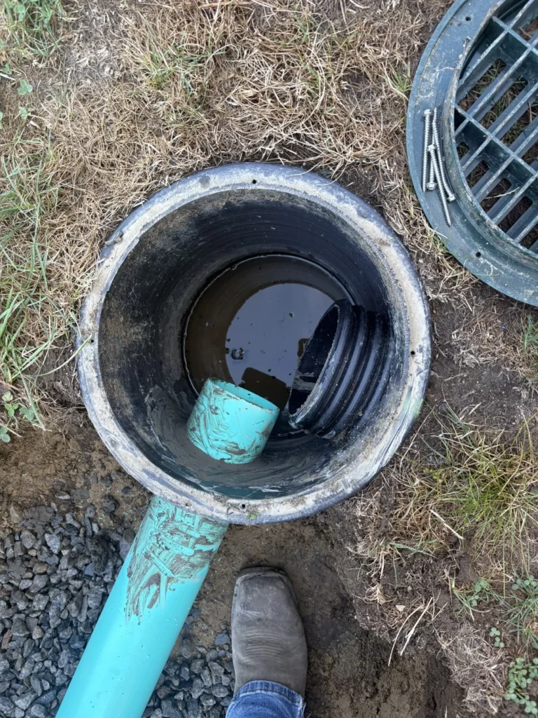 Drainage and walkway preparation beside a building