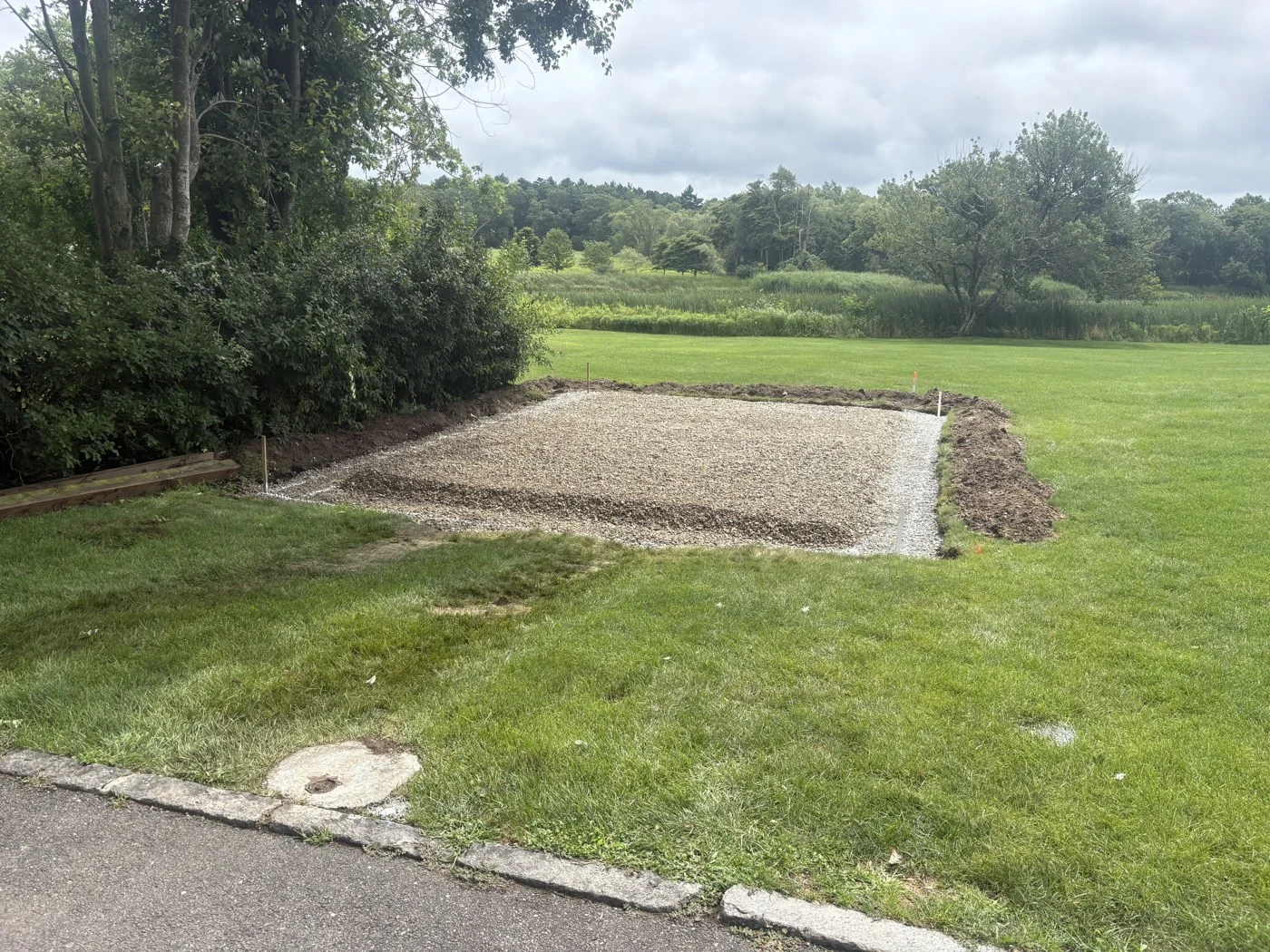 Leveled aggregate pad after excavation and base preparation